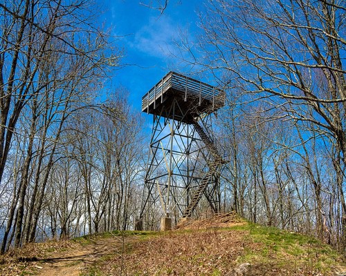 blue skies above old mountain watch tower wesser bald fire tower near Bryson CIty NC