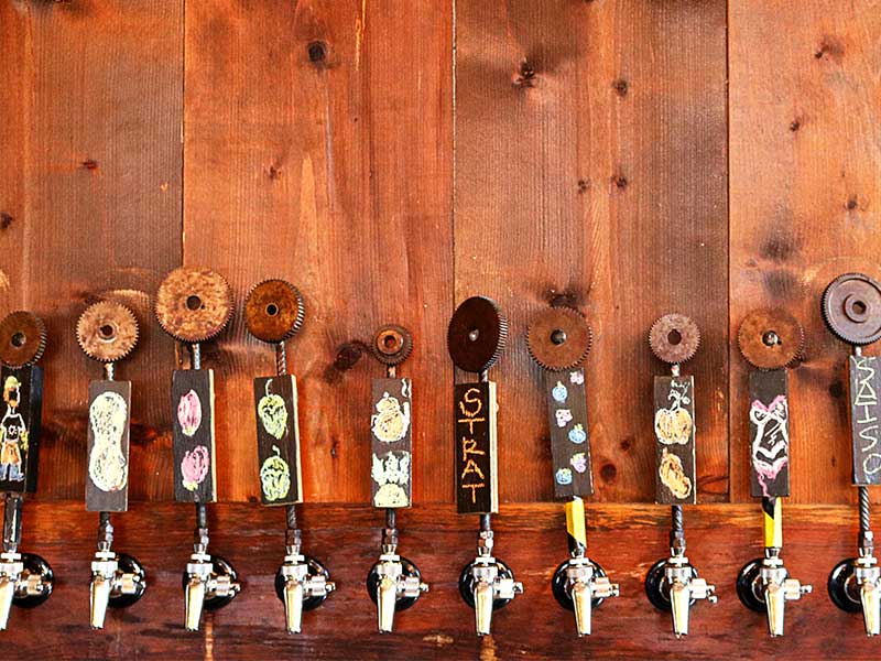 many beer taps with creative handmade handles from Innovation Brewing