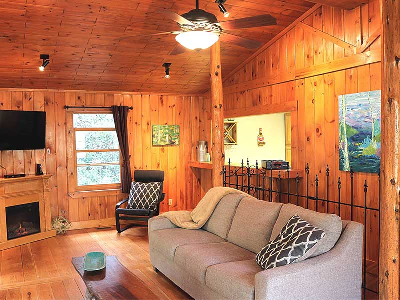 tongue and groove interior living room of The Historic Ol Gun Range large group cabin