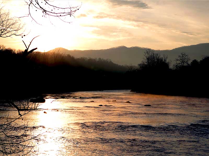 majestic sunrise over the Tuckasegee River a top things to do in Bryson City NC